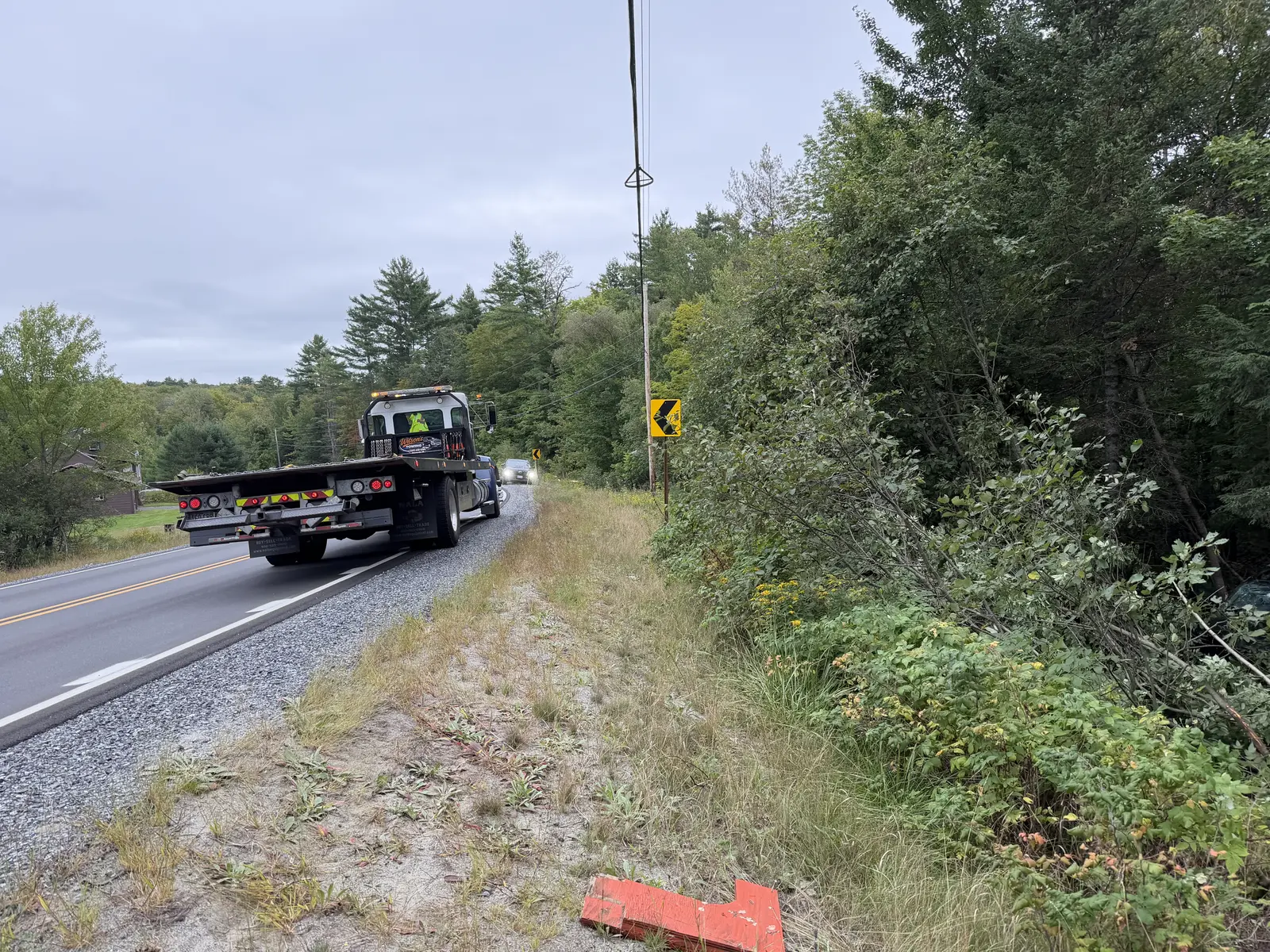 Wilson’s Towing roadside assistance truck responding on a rural Central Maine road